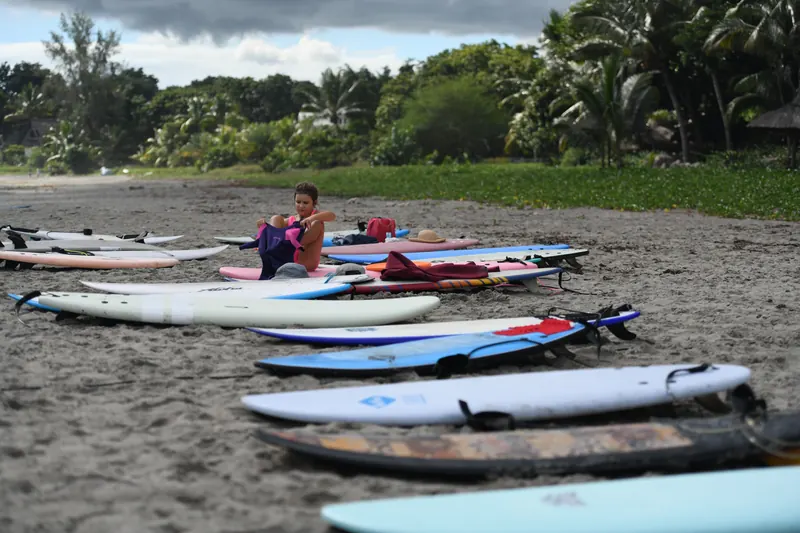 Soft-top boards laid out in a row on the sand before the heats.