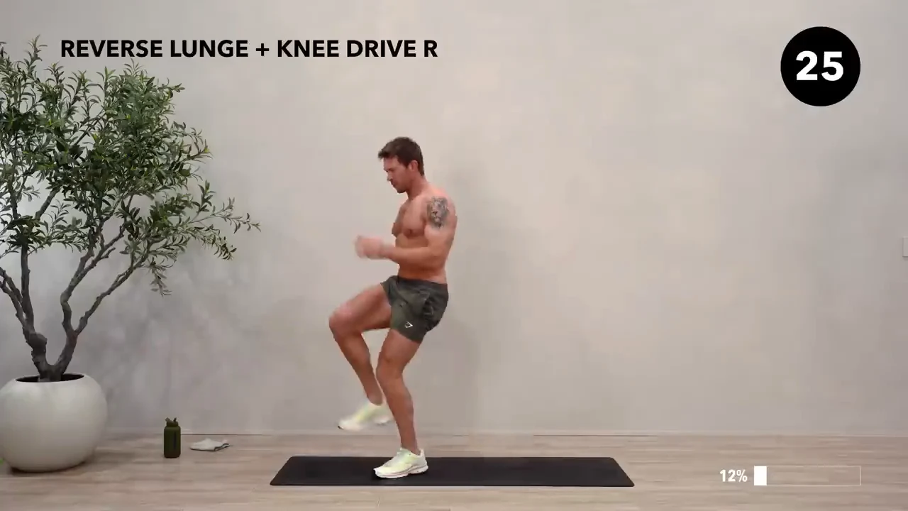 Dan the HIIT Man demonstrating reverse lunge + knee drive — right.