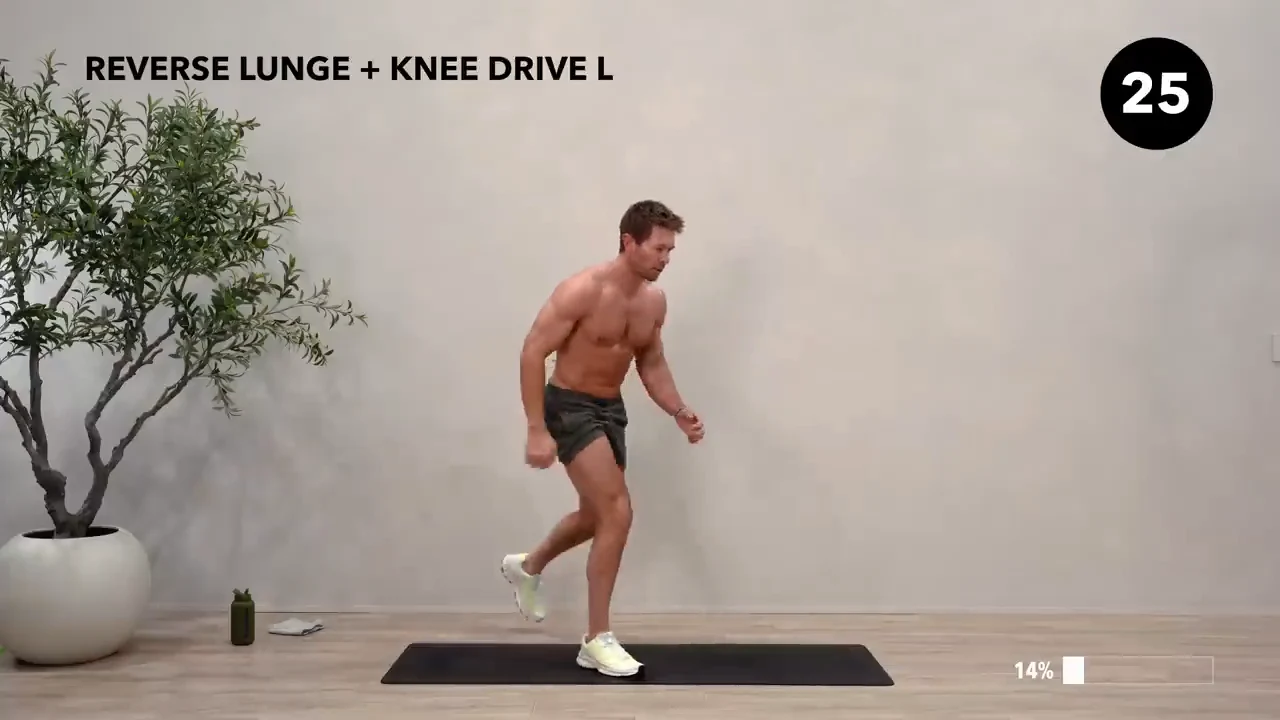 Dan the HIIT Man demonstrating reverse lunge + knee drive — left.