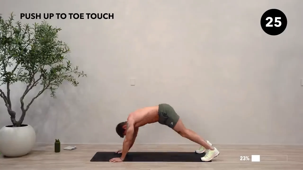 Dan the HIIT Man demonstrating push-up to toe touch.