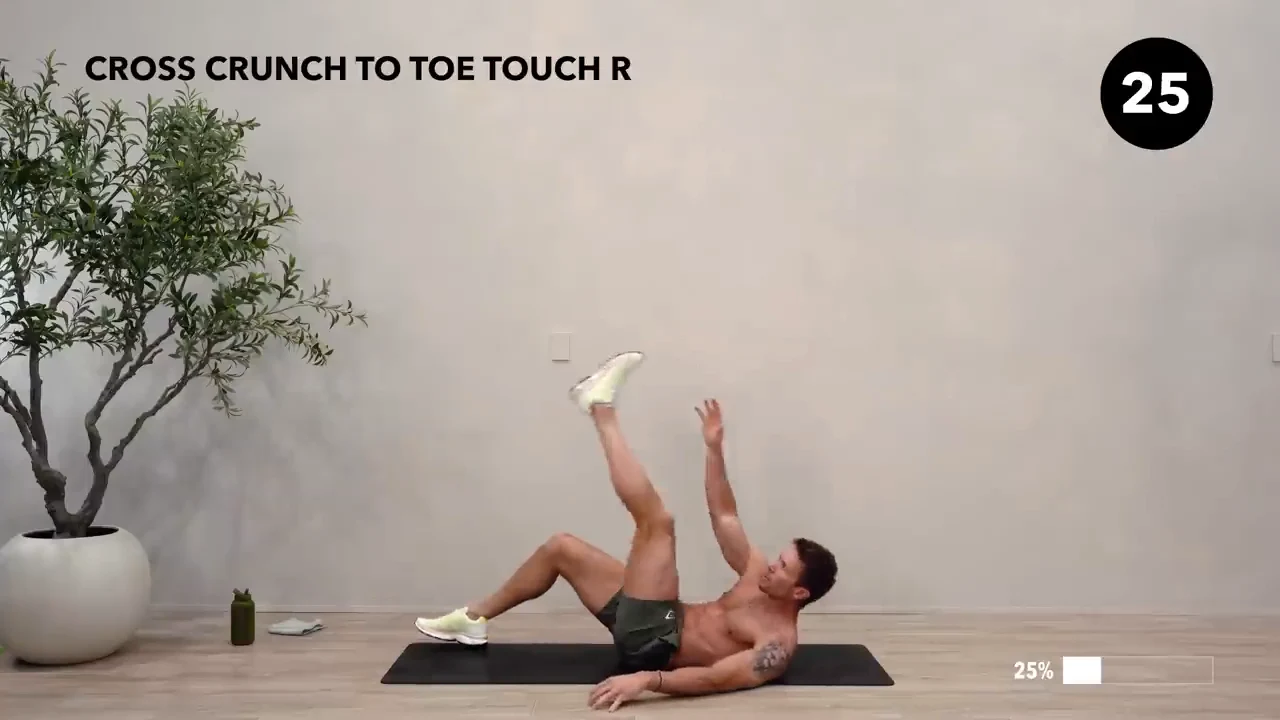 Dan the HIIT Man demonstrating cross crunch to toe touch — right.