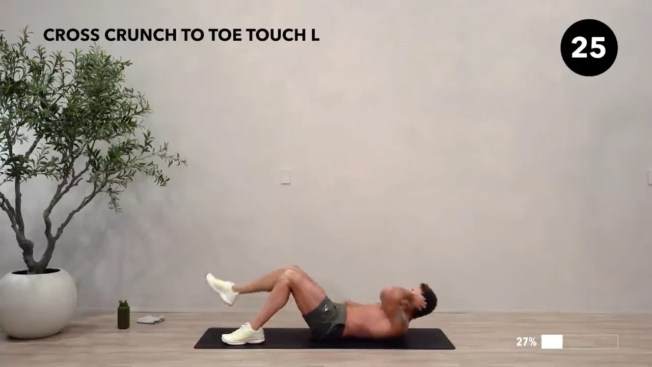 Dan the HIIT Man demonstrating cross crunch to toe touch — left.