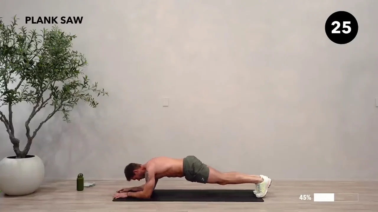 Dan the HIIT Man demonstrating plank saw.