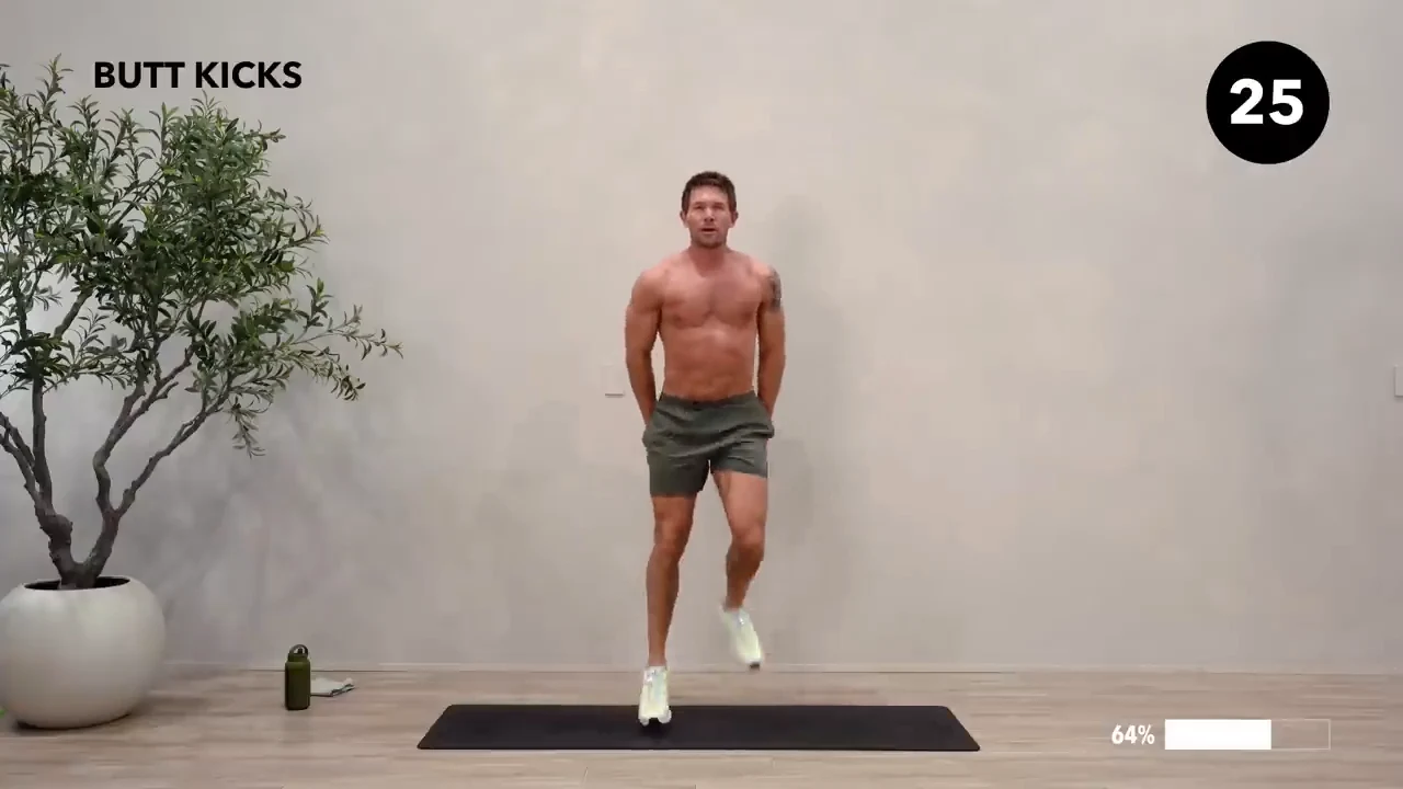 Dan the HIIT Man demonstrating butt kicks.