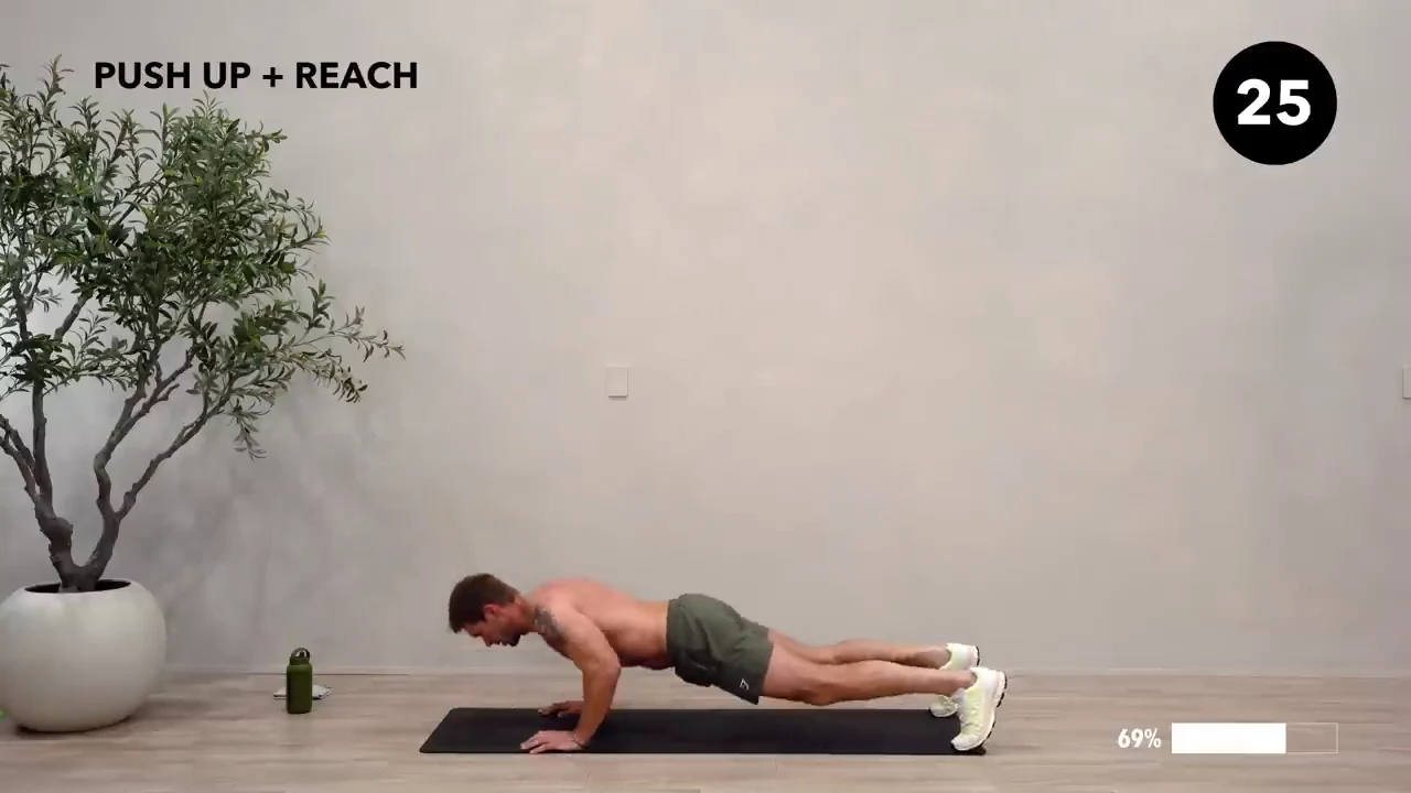 Dan the HIIT Man demonstrating push-up + reach.