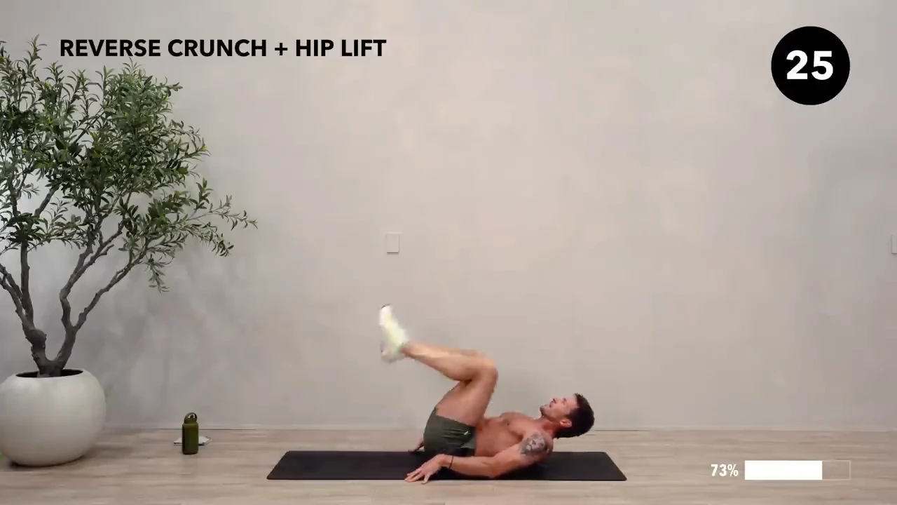 Dan the HIIT Man demonstrating reverse crunch + hip lift.