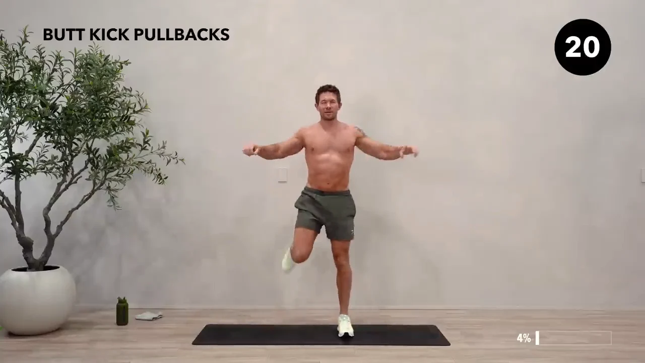 Dan the HIIT Man demonstrating butt kick pullbacks.